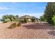Spacious backyard with low-maintenance stone landscaping, vibrant greenery, and a decorative fountain, ideal for relaxation at 8650 Sw 83Rd Loop, Ocala, FL 34481