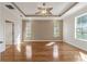 Spacious bedroom with laminate floors, trey ceiling, ceiling fan, and natural light at 8650 Sw 83Rd Loop, Ocala, FL 34481