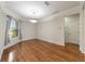 Dining area features laminate floors, a modern chandelier, and natural light at 8650 Sw 83Rd Loop, Ocala, FL 34481
