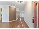 Inviting foyer featuring wood flooring, neutral walls, and an open view of the living spaces at 8650 Sw 83Rd Loop, Ocala, FL 34481