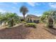 Attractive home with vibrant landscaping including palm trees and a manicured garden at 8650 Sw 83Rd Loop, Ocala, FL 34481