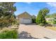 Charming home featuring a brick driveway leading to a two-car garage with updated doors at 8650 Sw 83Rd Loop, Ocala, FL 34481