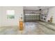 Spacious garage with white walls and concrete floor and windows at 8650 Sw 83Rd Loop, Ocala, FL 34481