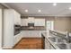 Kitchen features granite countertops, stainless steel appliances, and ample storage at 8650 Sw 83Rd Loop, Ocala, FL 34481