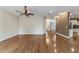Bright living room with open floor plan and gleaming hardwood floors throughout at 8650 Sw 83Rd Loop, Ocala, FL 34481