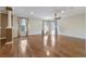 Spacious living room with wood floors, bright windows, and a ceiling fan at 8650 Sw 83Rd Loop, Ocala, FL 34481
