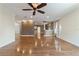 Living room with hardwood flooring and adjacent spaces, offering open concept design at 8650 Sw 83Rd Loop, Ocala, FL 34481