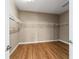 Empty walk-in closet showing wire shelving and wood floors at 8650 Sw 83Rd Loop, Ocala, FL 34481