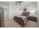 Well-lit bedroom boasts a comfortable bed, bedside tables, and a double door closet for ample storage at 8870 Sw 62Nd Ave, Ocala, FL 34476