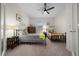 Bright bedroom features a ceiling fan and two beds with bedside tables, ideal for  at 8870 Sw 62Nd Ave, Ocala, FL 34476