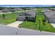 Charming single-story home featuring a well-manicured lawn and a two-car garage at 8870 Sw 62Nd Ave, Ocala, FL 34476