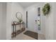 Bright foyer with decoratively appointed console table with front door in view at 8870 Sw 62Nd Ave, Ocala, FL 34476