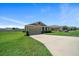 Charming single-story home featuring a well-manicured lawn and attached two-car garage at 8870 Sw 62Nd Ave, Ocala, FL 34476