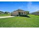Charming single-story home featuring a well-manicured lawn and attached two-car garage at 8870 Sw 62Nd Ave, Ocala, FL 34476