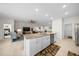 This kitchen island offers granite countertops and is centrally located to the Gathering room, dining room, and bedrooms at 8870 Sw 62Nd Ave, Ocala, FL 34476