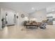 Spacious living room with tile floors with front door and kitchen in view at 8870 Sw 62Nd Ave, Ocala, FL 34476