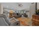 Spacious living room with tile floors with kitchen in view and comfortable seating at 8870 Sw 62Nd Ave, Ocala, FL 34476