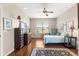 Spacious bedroom featuring hard floors, a ceiling fan, and sunny windows at 9628 Sw 90Th St, Ocala, FL 34481