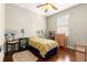 Bedroom featuring wood floors, a ceiling fan, and natural light at 9628 Sw 90Th St, Ocala, FL 34481