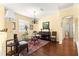 Inviting living room featuring hardwood floors and a large window at 9628 Sw 90Th St, Ocala, FL 34481
