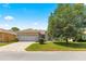 Charming single-story home with manicured front lawn, brick driveway, and attached two-car garage at 9628 Sw 90Th St, Ocala, FL 34481