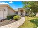 Charming home featuring a decorative front entrance and beautiful landscaping at 9628 Sw 90Th St, Ocala, FL 34481