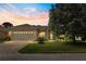 Charming home featuring a two-car garage and a well-manicured lawn at sunset at 9628 Sw 90Th St, Ocala, FL 34481