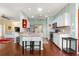 Open kitchen with granite countertops, stainless appliances, and hardwood floors at 9628 Sw 90Th St, Ocala, FL 34481