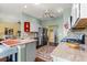 A modern kitchen featuring stainless appliances, granite countertops, and hardwood floors at 9628 Sw 90Th St, Ocala, FL 34481