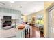 A contemporary kitchen with stainless appliances, granite countertops, and hardwood floors at 9628 Sw 90Th St, Ocala, FL 34481