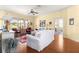Bright living room with hardwood floors, ceiling fan and sliding glass doors at 9628 Sw 90Th St, Ocala, FL 34481