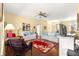 A lovely living room with hardwood floors, ceiling fan, and wicker chairs at 9628 Sw 90Th St, Ocala, FL 34481