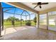 Comfortable screened lanai with a ceiling fan and stunning views of the beautiful, green golf course at 9628 Sw 90Th St, Ocala, FL 34481