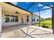 Screened patio with stone-style pavers offers a relaxing outdoor space with an inviting view at 9628 Sw 90Th St, Ocala, FL 34481