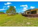 Lush green backyard with a picturesque view of neighboring homes and well-maintained landscaping at 9642 Sw 95Th Loop, Ocala, FL 34481
