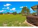 Expansive backyard with well-maintained landscaping and a picturesque view of neighboring homes at 9642 Sw 95Th Loop, Ocala, FL 34481