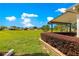 Spacious green backyard featuring well-manicured landscaping and views of neighboring homes at 9642 Sw 95Th Loop, Ocala, FL 34481