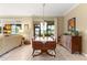 Traditional dining room featuring a wooden table, hutch, and sliding glass doors to the backyard at 9642 Sw 95Th Loop, Ocala, FL 34481
