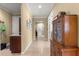 Spacious hallway with tile flooring, crown molding, and classic decor at 9642 Sw 95Th Loop, Ocala, FL 34481