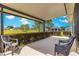 Covered patio featuring a beautiful outdoor view of the lush green space and manicured landscaping at 9642 Sw 95Th Loop, Ocala, FL 34481