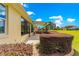 Covered patio showcasing outdoor views of a lush green space with well-manicured landscaping at 9642 Sw 95Th Loop, Ocala, FL 34481