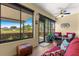 Screened-in porch offering views of the backyard and golf course beyond the property at 9642 Sw 95Th Loop, Ocala, FL 34481