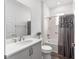 Bathroom featuring a single sink vanity with quartz countertop and a tub with shower at 10427 Sw 98Th Place Rd, Ocala, FL 34481