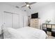 Inviting bedroom features wood-look floors, a closet, and a ceiling fan at 10427 Sw 98Th Place Rd, Ocala, FL 34481