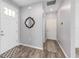 Modern entryway boasting stylish wood-look floors, fresh paint, and elegant decor elements at 10427 Sw 98Th Place Rd, Ocala, FL 34481