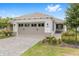 Charming single-story home featuring a two-car garage, well-maintained landscaping, and a welcoming entrance at 10427 Sw 98Th Place Rd, Ocala, FL 34481