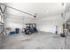 Spacious garage featuring a golf cart, offering ample room for vehicles and storage at 10427 Sw 98Th Place Rd, Ocala, FL 34481