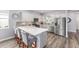 Stylish kitchen with stainless steel appliances, a spacious island, and modern finishes at 10427 Sw 98Th Place Rd, Ocala, FL 34481