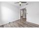 An open room featuring wood-style flooring, bright neutral walls, and an airy atmosphere at 10427 Sw 98Th Place Rd, Ocala, FL 34481