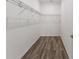 A walk-in closet with laminate floors and wire shelving, awaiting your personal organization at 10427 Sw 98Th Place Rd, Ocala, FL 34481